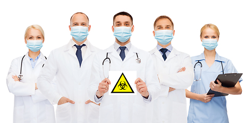 Image showing doctors in medical masks with biohazard sign