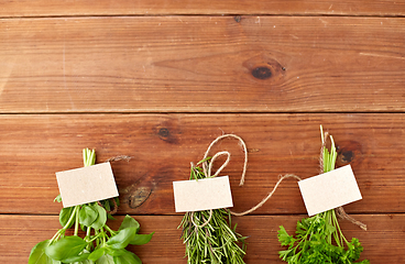 Image showing greens, spices or medicinal herbs on wooden boards