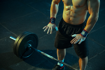 Image showing Caucasian man practicing in weightlifting in gym