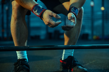 Image showing Caucasian man practicing in weightlifting in gym