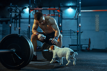 Image showing Caucasian man practicing in weightlifting in gym