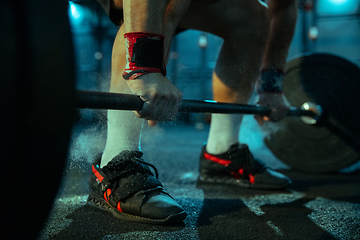 Image showing Caucasian man practicing in weightlifting in gym