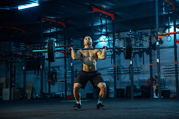 Image showing Caucasian man practicing in weightlifting in gym