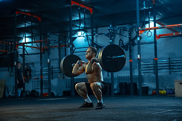 Image showing Caucasian man practicing in weightlifting in gym