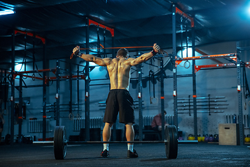 Image showing Caucasian man practicing in weightlifting in gym