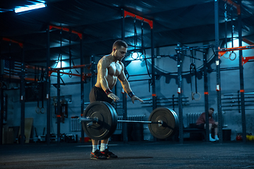 Image showing Caucasian man practicing in weightlifting in gym