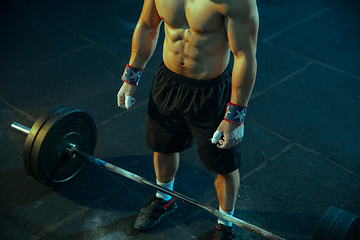 Image showing Caucasian man practicing in weightlifting in gym