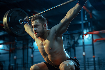 Image showing Caucasian man practicing in weightlifting in gym