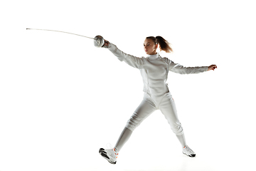 Image showing Teen girl in fencing costume with sword in hand isolated on white background