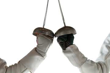 Image showing Teen girls in fencing costumes with swords in hands isolated on white background