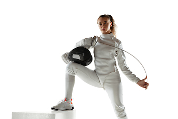 Image showing Teen girl in fencing costume with sword in hand isolated on white background