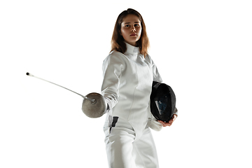 Image showing Teen girl in fencing costume with sword in hand isolated on white background