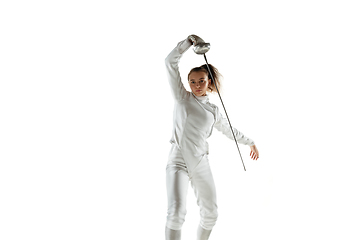 Image showing Teen girl in fencing costume with sword in hand isolated on white background