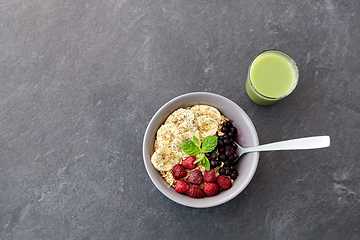 Image showing cereal breakfast with berries, banana and spoon