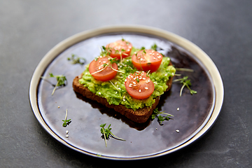 Image showing toast bread with mashed avocado and cherry tomato