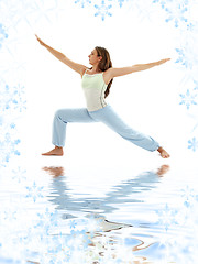 Image showing virabhadrasana warrior pose on white sand