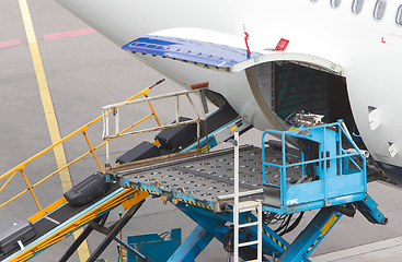 Image showing AMSTERDAM, NETHERLANDS - JUNE 29, 2017: Loading luggage in airpl