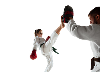 Image showing Junior in kimono practicing hand-to-hand combat with coach, martial arts