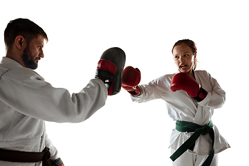 Image showing Junior in kimono practicing hand-to-hand combat with coach, martial arts