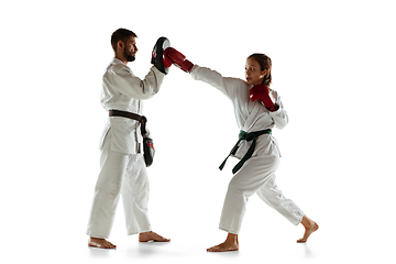 Image showing Junior in kimono practicing hand-to-hand combat with coach, martial arts