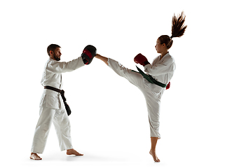 Image showing Junior in kimono practicing hand-to-hand combat with coach, martial arts