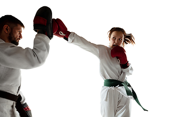 Image showing Junior in kimono practicing hand-to-hand combat with coach, martial arts