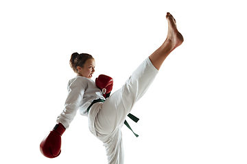 Image showing Confident junior in kimono practicing hand-to-hand combat, martial arts