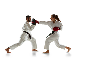 Image showing Junior in kimono practicing hand-to-hand combat with coach, martial arts