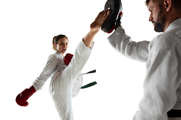 Image showing Junior in kimono practicing hand-to-hand combat with coach, martial arts