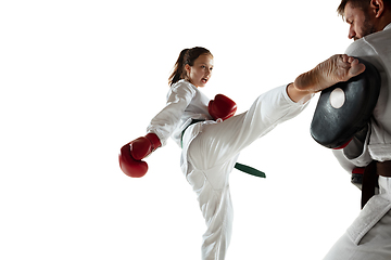 Image showing Junior in kimono practicing hand-to-hand combat with coach, martial arts