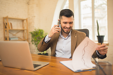 Image showing Man working in modern office using devices and gadgets during creative meeting.