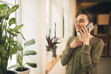 Image showing Woman working in modern office using devices and gadgets during creative meeting.