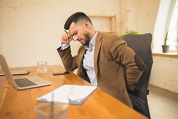 Image showing Man working in modern office using devices and gadgets during creative meeting.