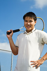 Image showing Asian man playing tennis