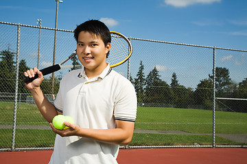 Image showing Asian man playing tennis