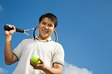 Image showing Asian male playing tennis