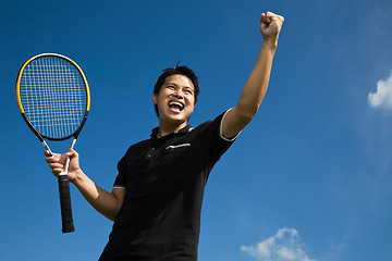 Image showing Asian tennis player in joy of victory