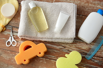 Image showing baby accessories for bathing on wooden table