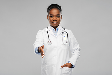 Image showing african american female doctor making handshake