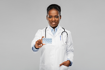 Image showing african american female doctor with medicine pills