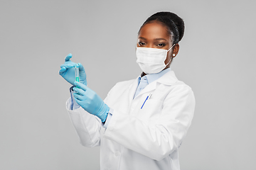 Image showing african american female doctor with syringe