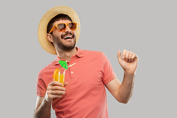 Image showing happy man in straw hat with orange juice cocktail