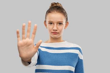 Image showing teenage girl making stopping gesture