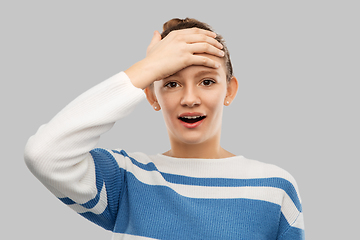 Image showing surprised teenage girl in pullover