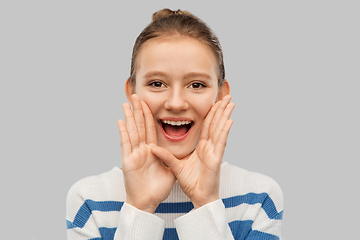 Image showing happy teenage girl calling someone