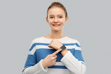 Image showing happy smiling teenage girl with smart watch