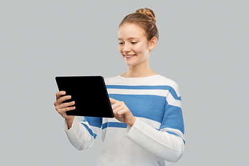 Image showing happy smiling teenage girl using tablet computer