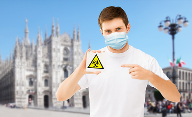 Image showing man in medical mask with biohazard sign in italy