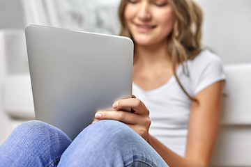 Image showing teenage girl with tablet pc computer at home