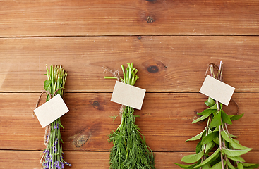 Image showing lavender, dill and peppermint on wooden background